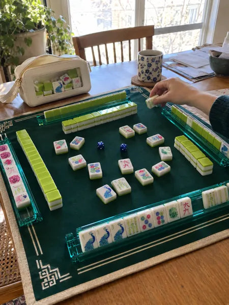 Mahjong set photographed at the table, accompanying review 2