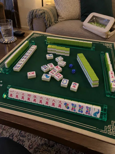 Mahjong set photographed at the table, accompanying review 1