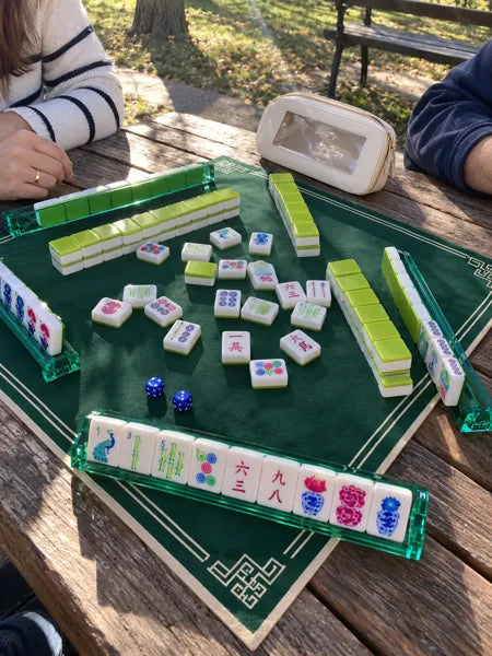 Mahjong set photographed at the table, accompanying review 3