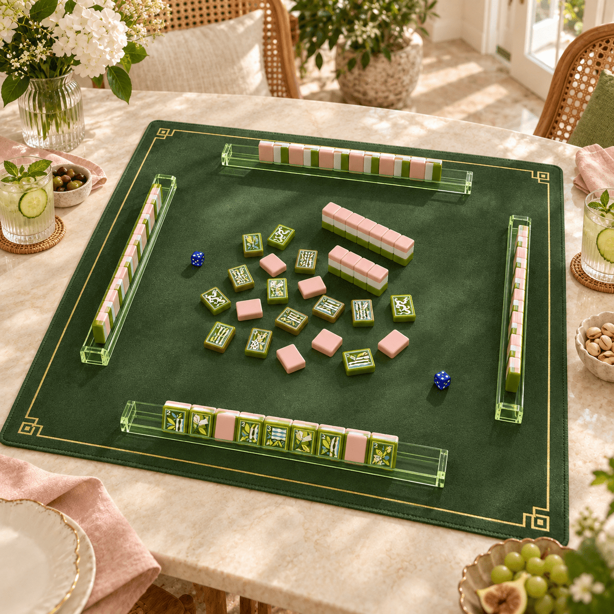Jade Social mahjong tiles in a styled game setting with a green mat, green racks and blue dice