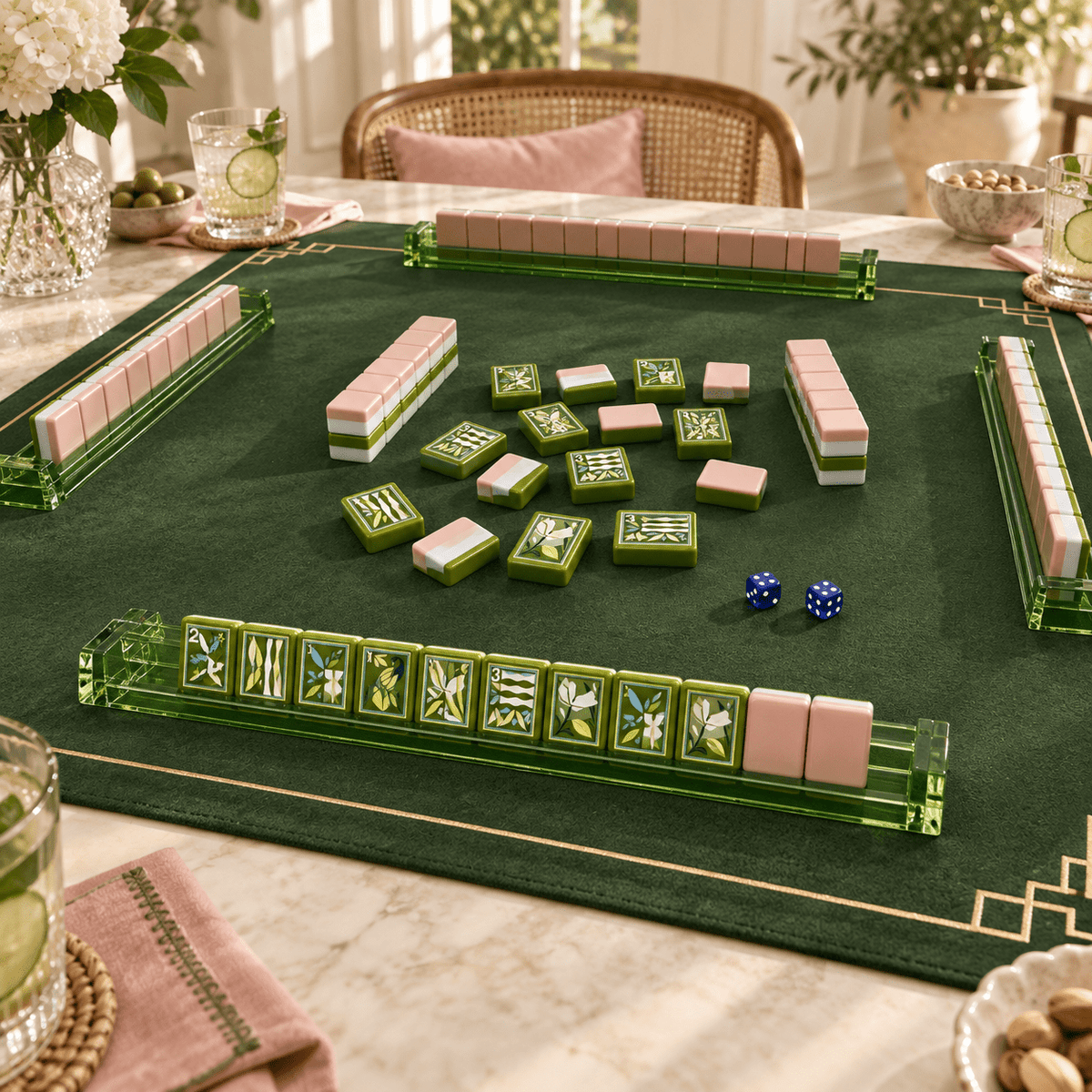 Jade Social mahjong tiles in a styled game setting with a green mat, green racks and blue dice