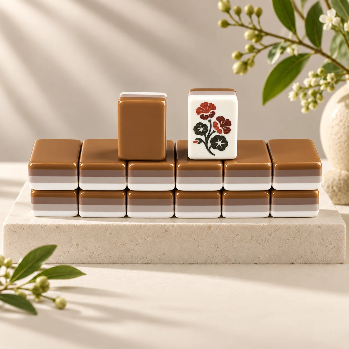 Mocha Social — tile backs and face arranged on a stone plinth