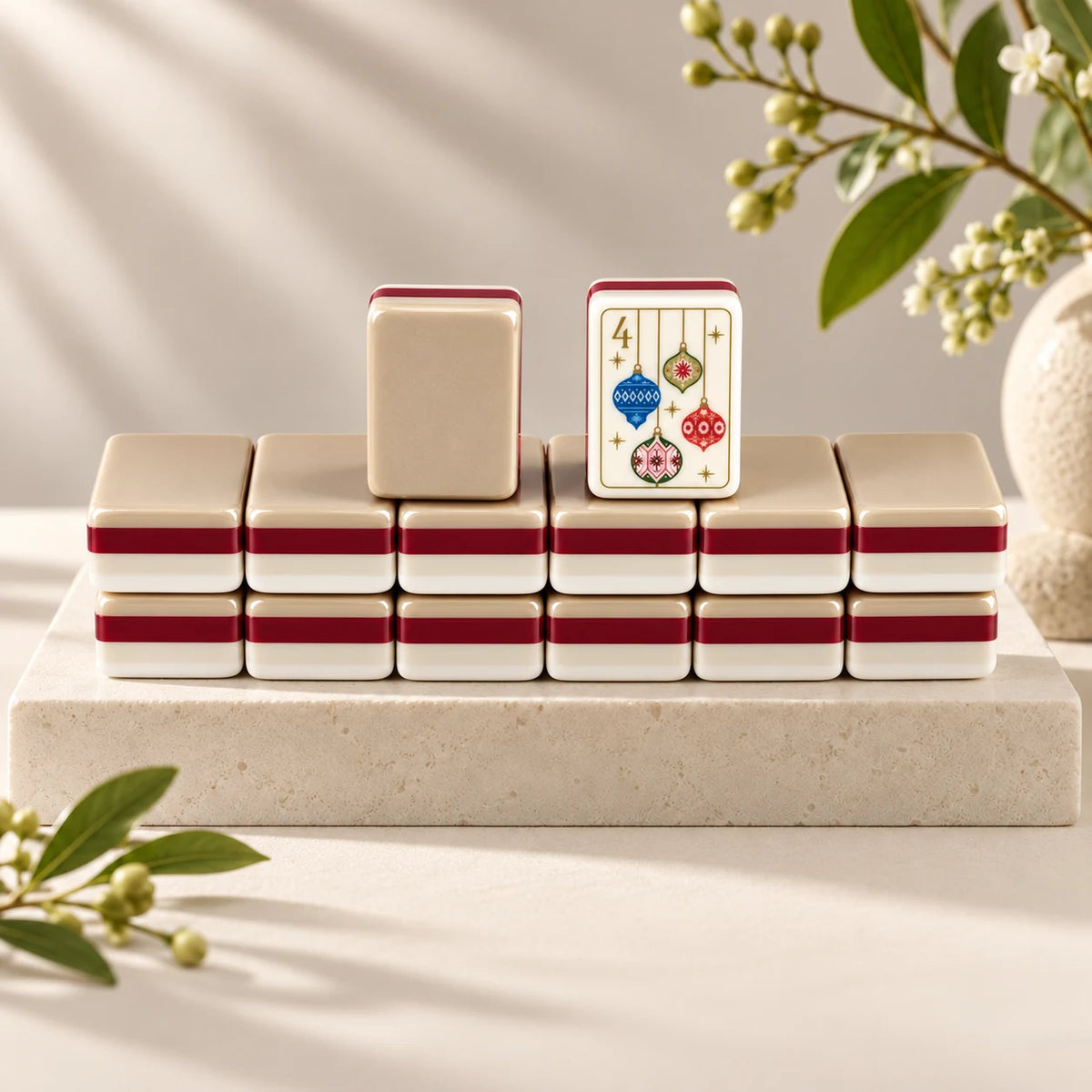 Noel Club — tile backs and face arranged on a stone plinth