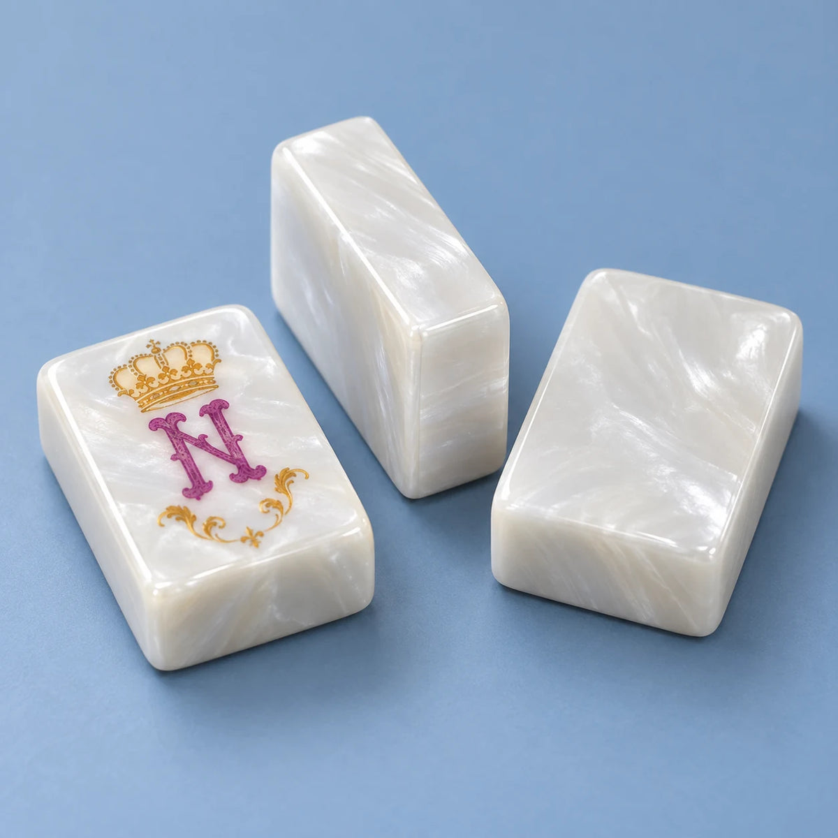 Crown Jewel American mahjong tile, close view of the finish and plain pearlescent white reverse