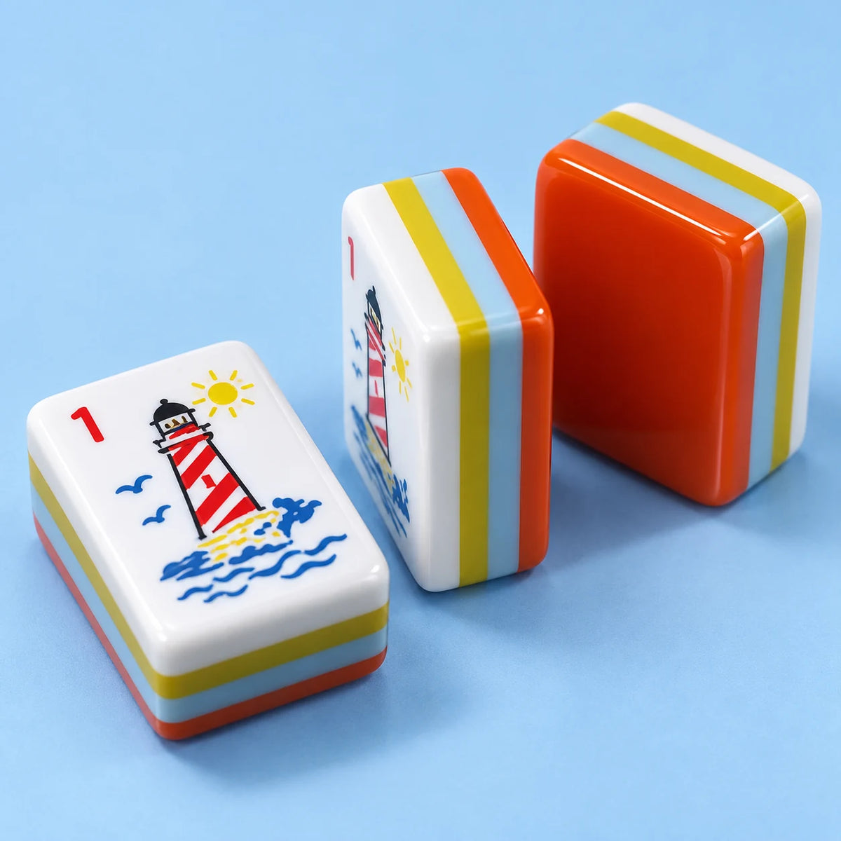 Harbour Hour American mahjong tile, close view of the finish and orange reverse with light blue, yellow and white layers