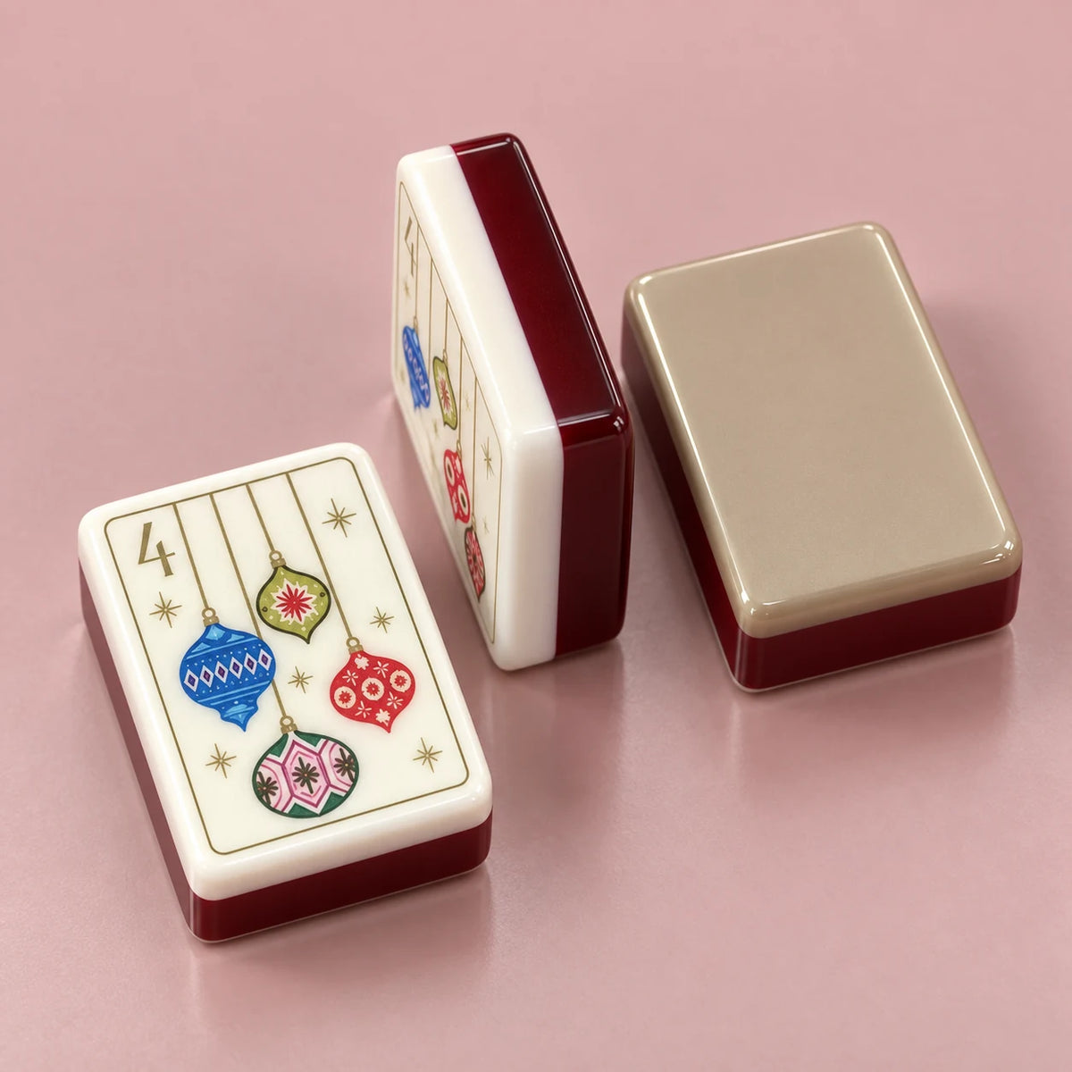 Noel Club American mahjong tile, close view of the finish and champagne-colored reverse with burgundy side layers