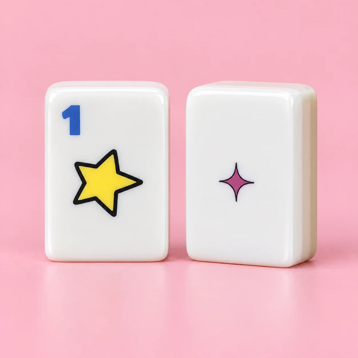 Pop Club American mahjong tiles, white tile face with colorful comic-inspired artwork and white reverse with a small magenta star