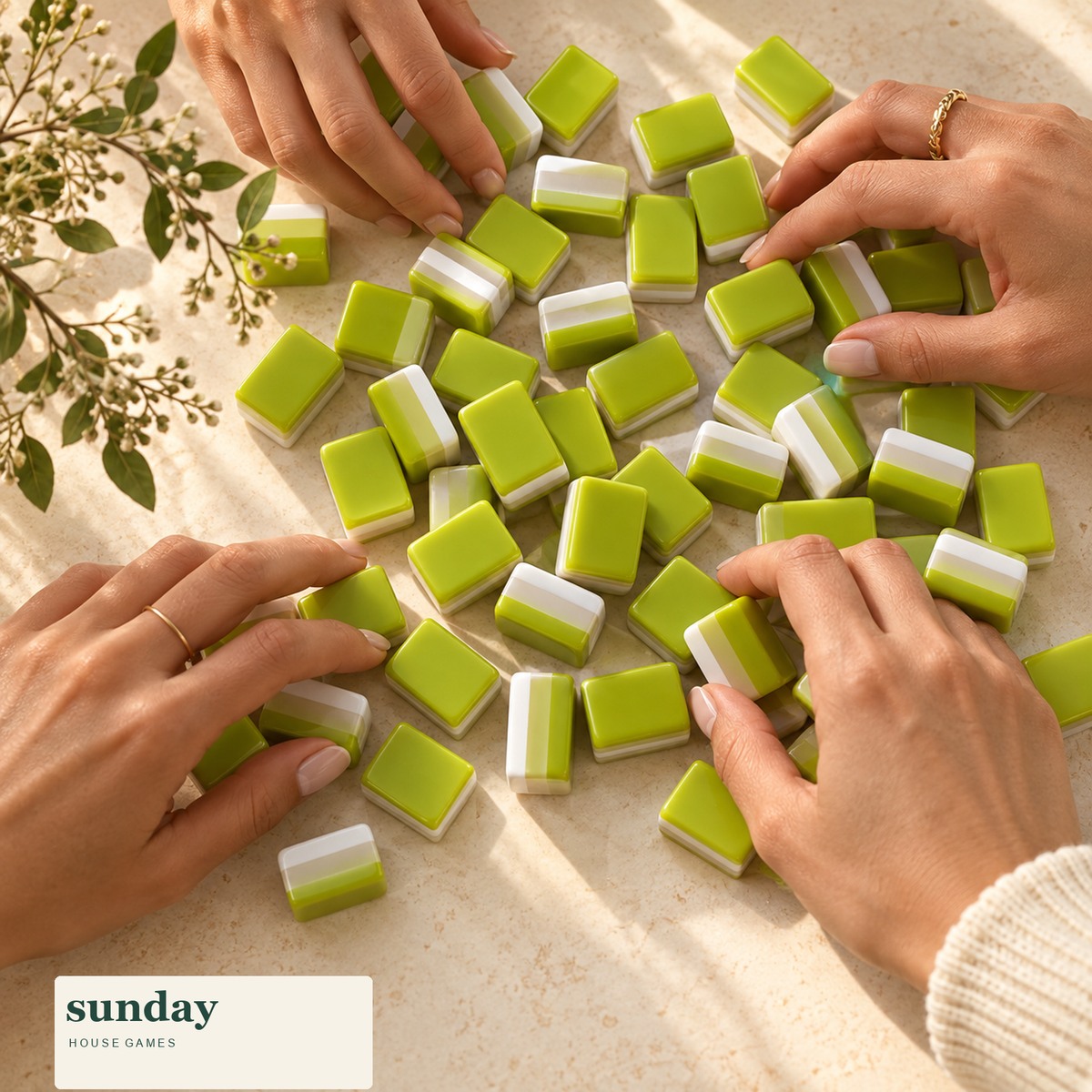 Appletini apple green american mahjong tiles — hands with tiles