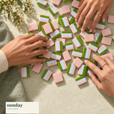 Jade Social green pearl american mahjong tiles — hands with tiles