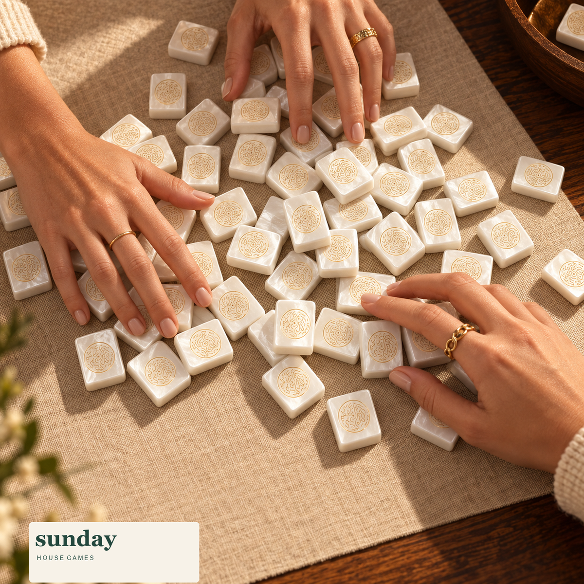 Noir & Gold black gold american mahjong tiles — hands with tiles