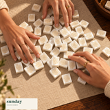 Noir & Gold black gold american mahjong tiles — hands with tiles