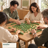 Petite — Matcha green mini chinese mahjong set — friends gathered around the tiles