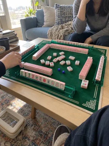 Mahjong set photographed at the table, accompanying review 8